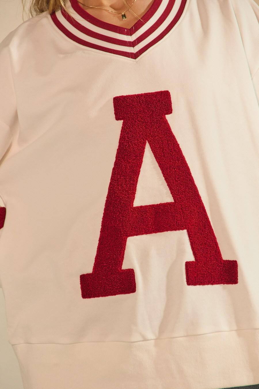A Varsity Pullover in White and Crimson